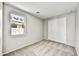 Well-lit bedroom featuring neutral carpet, double door closet, and a bright window for an airy, comfortable feel at 17296 W Desert Sage Dr, Goodyear, AZ 85338