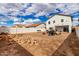 Spacious backyard featuring an open space and barbecue equipment, ready for outdoor activities and relaxation at 18316 N Soft Wind Dr, Maricopa, AZ 85138