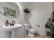 This powder room features a decorative mirror and pedestal sink at 18316 N Soft Wind Dr, Maricopa, AZ 85138