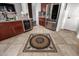 Spacious kitchen features stainless steel refrigerator, wine cooler and decorative tile flooring at 18316 N Soft Wind Dr, Maricopa, AZ 85138