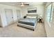 Comfortable bedroom with neutral tones, a ceiling fan, and ample natural light at 1901 E Missouri Ave # 220, Phoenix, AZ 85016