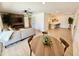 Open concept living area boasts a fireplace, modern lighting, and tile floors at 1901 E Missouri Ave # 220, Phoenix, AZ 85016