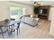 Inviting living room with fireplace, light paint, large window, and comfortable seating at 1901 E Missouri Ave # 220, Phoenix, AZ 85016