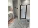 Well-lit bathroom with glass shower, tile flooring, and vanity sink at 19864 W San Juan Ave, Litchfield Park, AZ 85340