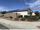 Beautiful home featuring desert landscaping, block wall fencing, and installed solar panels at 19864 W San Juan Ave, Litchfield Park, AZ 85340