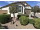 Beautiful home with desert landscaping and lush, green shrubbery at 19864 W San Juan Ave, Litchfield Park, AZ 85340