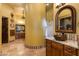 Elegant bathroom featuring dual vanities, decorative mirrors, and custom tile work, creating a spa-like retreat at 2005 N Pomelo --, Mesa, AZ 85215