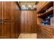 Custom closet offers ample storage with well-organized shelving, drawers, and hanging spaces for a streamlined wardrobe at 2005 N Pomelo --, Mesa, AZ 85215