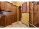 Hallway view featuring custom cabinetry, decorative accents, and archway into connecting room at 2005 N Pomelo --, Mesa, AZ 85215