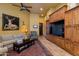 Inviting living room with custom built-ins, a ceiling fan, and a cozy seating area perfect for entertaining at 2005 N Pomelo --, Mesa, AZ 85215