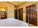 Inviting main bedroom with wooden doors and ensuite bath at 2005 N Pomelo --, Mesa, AZ 85215