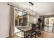 Bright dining room with modern light fixture and sliding glass door to the backyard at 2116 S Moccasin Trl, Gilbert, AZ 85295