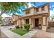 Beautiful two-story home with a covered porch, well-manicured lawn, and inviting curb appeal at 2116 S Moccasin Trl, Gilbert, AZ 85295