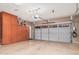 Spacious garage with storage cabinets, room for multiple vehicles, and an electric car charger at 2116 S Moccasin Trl, Gilbert, AZ 85295