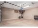 A well lit and organized garage with ample space, perfect for parking and storage at 2116 S Moccasin Trl, Gilbert, AZ 85295