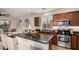 Stylish kitchen island with seating, stainless steel appliances, and contemporary decor in the background at 2116 S Moccasin Trl, Gilbert, AZ 85295