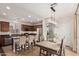 Modern kitchen featuring a center island, stainless steel appliances, and an adjacent dining area at 2116 S Moccasin Trl, Gilbert, AZ 85295