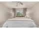 This main bedroom features neutral tones, natural light and a ceiling fan at 2116 S Moccasin Trl, Gilbert, AZ 85295