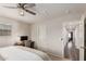 This main bedroom features neutral tones, natural light, and a ceiling fan at 2116 S Moccasin Trl, Gilbert, AZ 85295