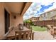 Covered patio with outdoor dining and a view of the beautiful backyard at 2116 S Moccasin Trl, Gilbert, AZ 85295