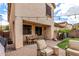 Inviting outdoor patio with a dining table, string lights, and cozy seating area perfect for entertaining at 2116 S Moccasin Trl, Gilbert, AZ 85295