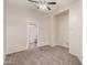 Neutral bedroom with carpet flooring, ceiling fan, and an ensuite bathroom at 22125 N 29Th Ave # 158, Phoenix, AZ 85027