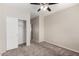 Neutral bedroom with carpet flooring, a closet, and a ceiling fan at 22125 N 29Th Ave # 158, Phoenix, AZ 85027