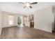 Inviting living area with vinyl flooring, neutral decor, and a view into the kitchen at 22125 N 29Th Ave # 158, Phoenix, AZ 85027