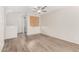 Living room space with stylish vinyl floors and natural light from the sliding glass door at 22125 N 29Th Ave # 158, Phoenix, AZ 85027