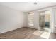 Vinyl flooring, and a sliding glass door in the sunlit living area at 22125 N 29Th Ave # 158, Phoenix, AZ 85027