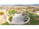 Aerial view highlighting a modern basketball court with landscaping and community seating in a Gathering-friendly neighborhood at 22800 E Via Las Brisas Rd, Queen Creek, AZ 85142