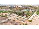 Overhead shot of a community garden, featuring planted beds, a shaded pavilion, and walkways for residents to enjoy at 22800 E Via Las Brisas Rd, Queen Creek, AZ 85142