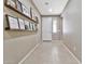 Bright entryway featuring tile floors and decorative wall shelves at 22800 E Via Las Brisas Rd, Queen Creek, AZ 85142