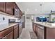 Spacious kitchen featuring stainless steel appliances, granite countertops, and tiled flooring at 22800 E Via Las Brisas Rd, Queen Creek, AZ 85142