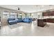 Bright and airy living room flows into the kitchen with island seating at 22800 E Via Las Brisas Rd, Queen Creek, AZ 85142