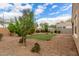 Desert backyard featuring synthetic grass, desert landscaping, and brick privacy walls at 2426 E San Gabriel Trl, Casa Grande, AZ 85194