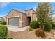 Inviting exterior view of a home showcasing desert landscaping, a tiled roof, and a quaint covered entrance at 2426 E San Gabriel Trl, Casa Grande, AZ 85194