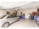 Spacious garage with ample storage, workbench, and parked vehicle at 2426 E San Gabriel Trl, Casa Grande, AZ 85194