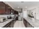 Beautiful kitchen with stainless steel appliances, ample counter space, and dark cabinets at 2426 E San Gabriel Trl, Casa Grande, AZ 85194