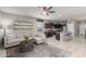 Open-concept living area with tile flooring seamlessly blending the living room and kitchen at 2426 E San Gabriel Trl, Casa Grande, AZ 85194