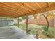 A covered back patio with string lights provides an attractive outdoor entertaining space at 2501 N 114Th Ave, Avondale, AZ 85392