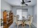 Dining room featuring a glass top table, ornate chairs, and decorative shelving at 2501 N 114Th Ave, Avondale, AZ 85392