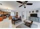 Open-concept living area with tile flooring, ceiling fan, and spacious layout seamlessly connects to dining area and kitchen at 2501 N 114Th Ave, Avondale, AZ 85392