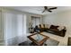 Comfortable living room featuring a large sectional sofa and tile flooring at 2501 N 114Th Ave, Avondale, AZ 85392