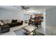 Open concept living and dining area with tile floors and a view into the kitchen at 2501 N 114Th Ave, Avondale, AZ 85392