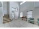 Bright living room with tile floors, high ceilings, stairs and a chandelier at 2501 N 114Th Ave, Avondale, AZ 85392