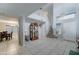 Bright living room with tile floors, high ceilings, stairs and an adjacent dining area at 2501 N 114Th Ave, Avondale, AZ 85392