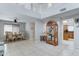 Bright living room with tile floors, high ceilings, and an adjacent dining area at 2501 N 114Th Ave, Avondale, AZ 85392