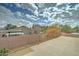 A spacious rooftop deck with metal railing provides expansive views of the neighborhood and cloudy skies at 2501 N 114Th Ave, Avondale, AZ 85392