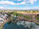 Aerial view of community featuring golf course, pond, and views of the city at 2537 N Miller Rd, Scottsdale, AZ 85257